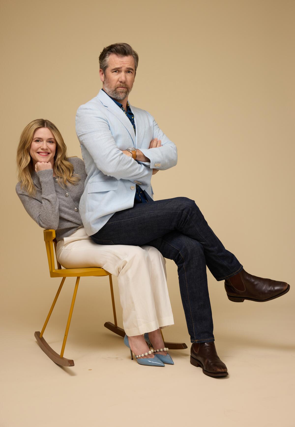  Patrick Brammal sits on his wife Harriet Dyer's lap for a portrait.