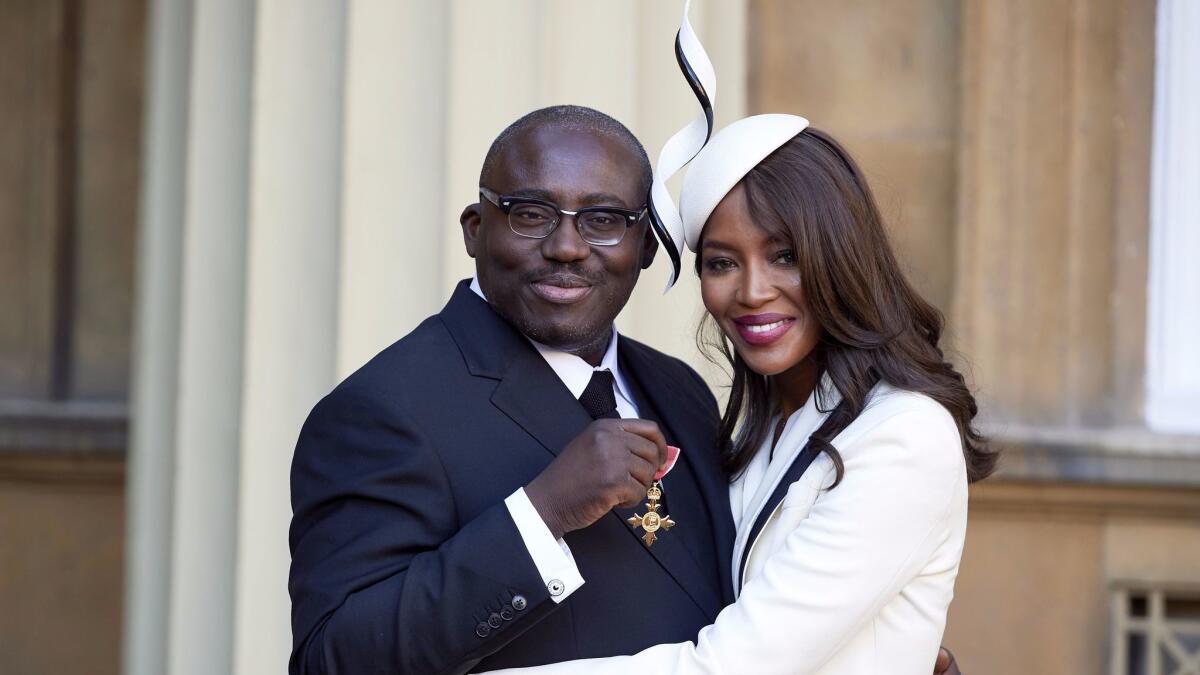Edward Enninful after receiving his Officer of the Order of the British Empire (OBE) and Naomi Campbell during the investiture ceremony at Buckingham Palace in London on Oct. 27, 2016.