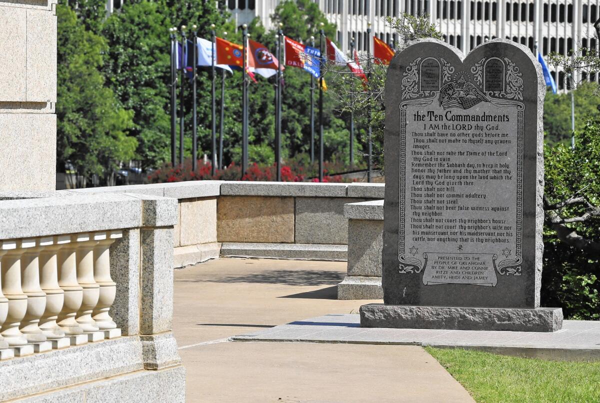 The Oklahoma Supreme Court ruled that placement of the Ten Commandments monument at the Capitol in Oklahoma City violated the state Constitution.