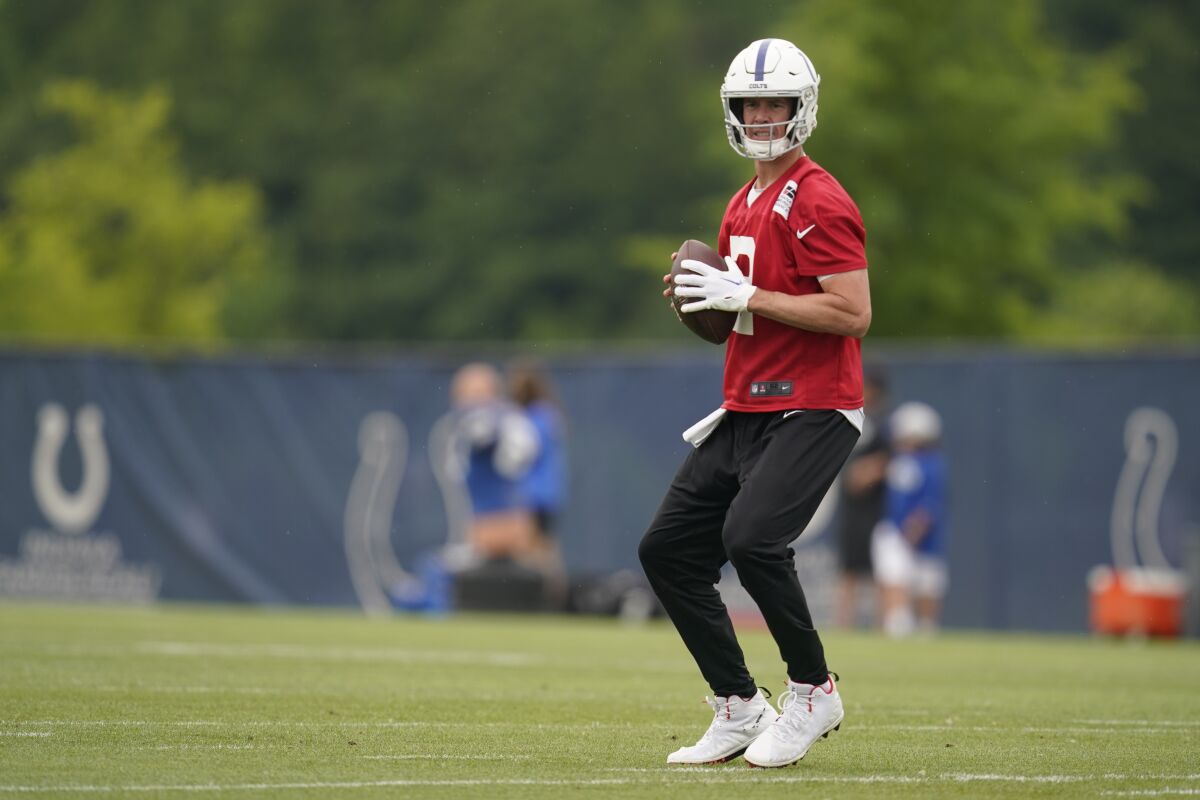FILE - Indianapolis Colts quarterback Matt Ryan throws during a practice at the NFL football team's training facility in Indianapolis, Ind., on Wednesday, June 8, 2022. A late-season collapse kept the Indianapolis Colts out of last year's playoffs. They don't plan to make the same mistake twice. (AP Photo/Darron Cummings, File)
