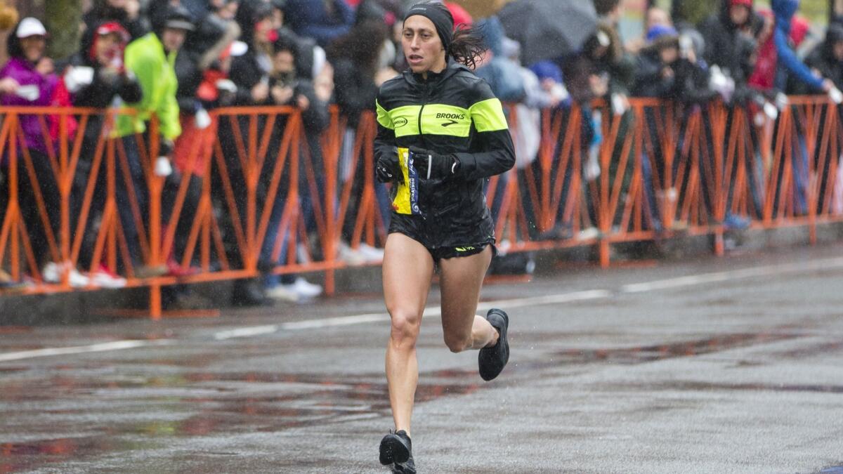 Desiree Linden approaches the 24-mile marker of the 2018 Boston Marathon on Monday in Brookline, Massachusetts. Linden became the first American winner since 1985 with an unofficial time of 2:39:54.
