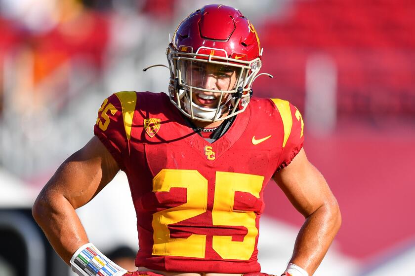 USC linebacker Tackett Curtis stands with his hands on his hips and looks up field during the Trojans' season opener