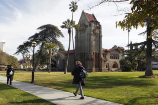 People walk past Tower Hall on the San Jose State University campus after the school announced a partnership with Udacity in San Jose, Calif. on Tuesday, Jan. 15, 2013, to offer online courses. The pilot program will begin this semester with two math classes and one statistics course. (Photo By Paul Chinn/The San Francisco Chronicle via Getty Images)