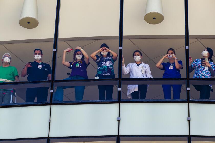 Some 25 aircraft participated in a flyover of local hospitals to salute health care workers on Friday morning, April 24, 2020. At Sharp Memorial Hospital in Kearny Mesa patients and healthcare workers lined the windows to watch the flyby.