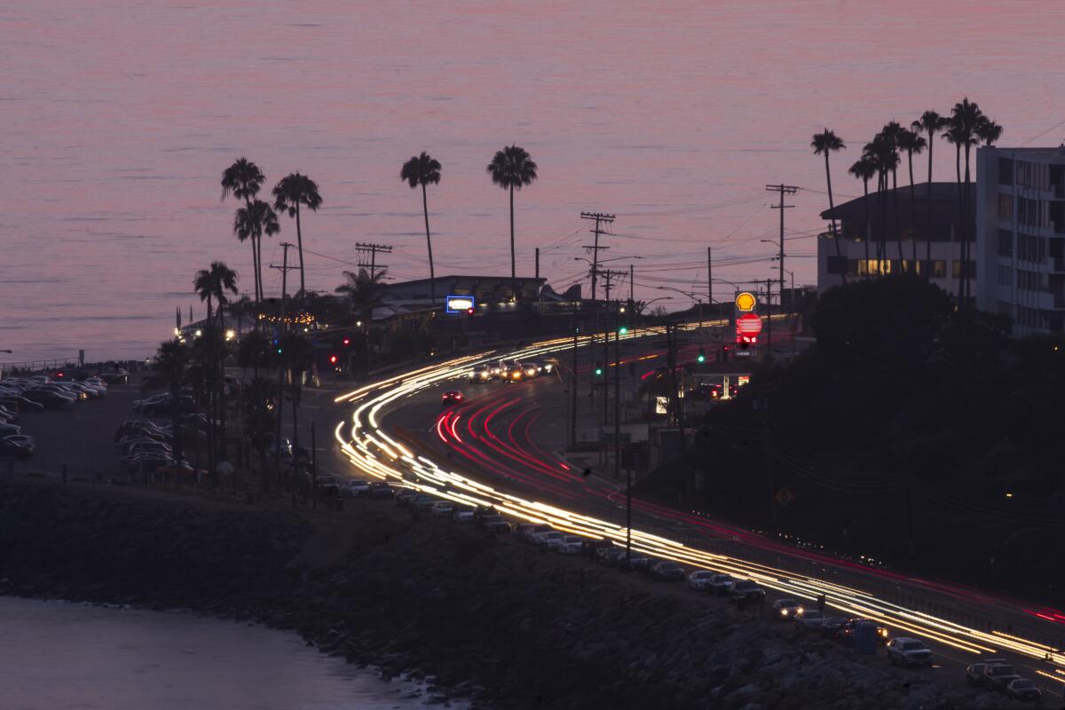 Traffic streaks along Pacific Coast Highway, one of the great summer drives in the nation.