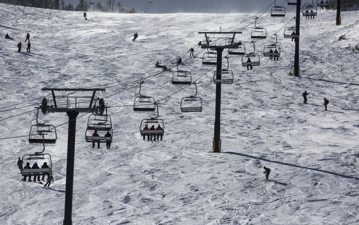 Skiers and snowboarders on the slopes at Mammoth Mountain in Mammoth Lakes, Calif., in early December.