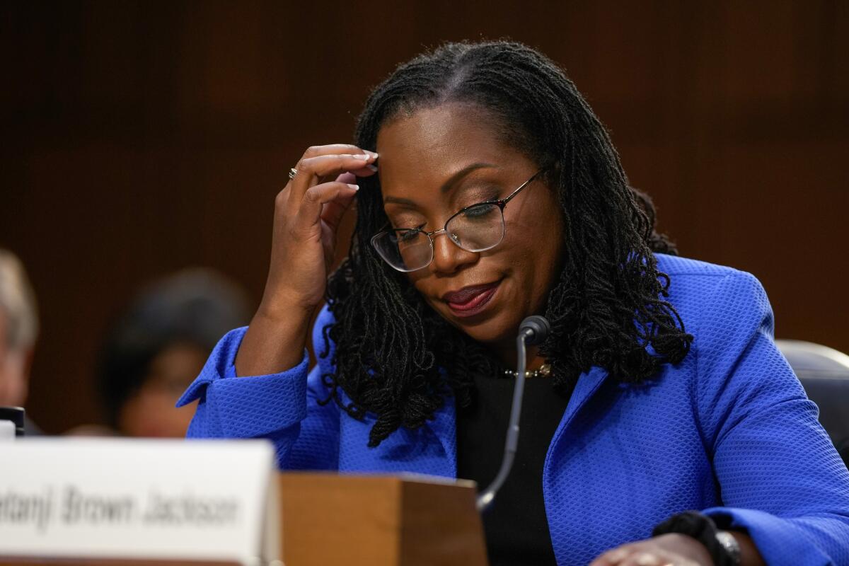 Supreme Court nominee Judge Ketanji Brown Jackson looks down at the table in front of her