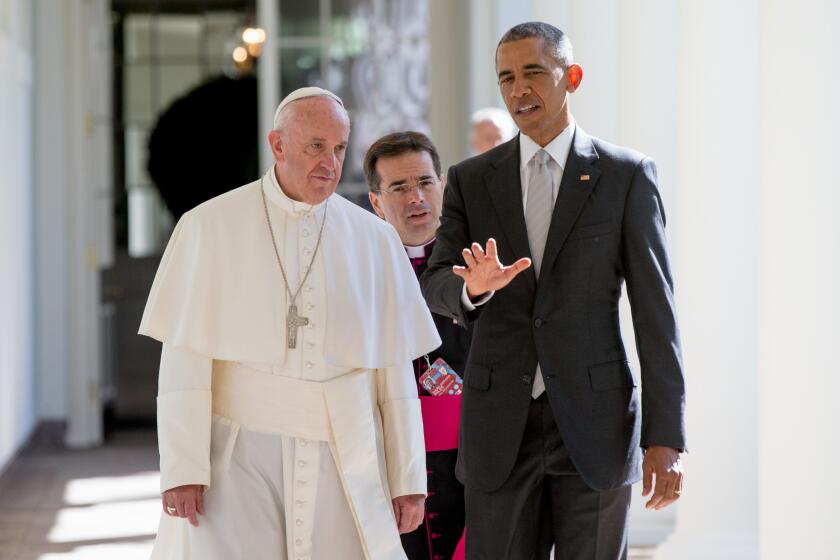 Vatican interpreter Msgr. Mark Miles, center, walks with Pope Francis and President Obama outside the White House in Washington on Sept. 23.