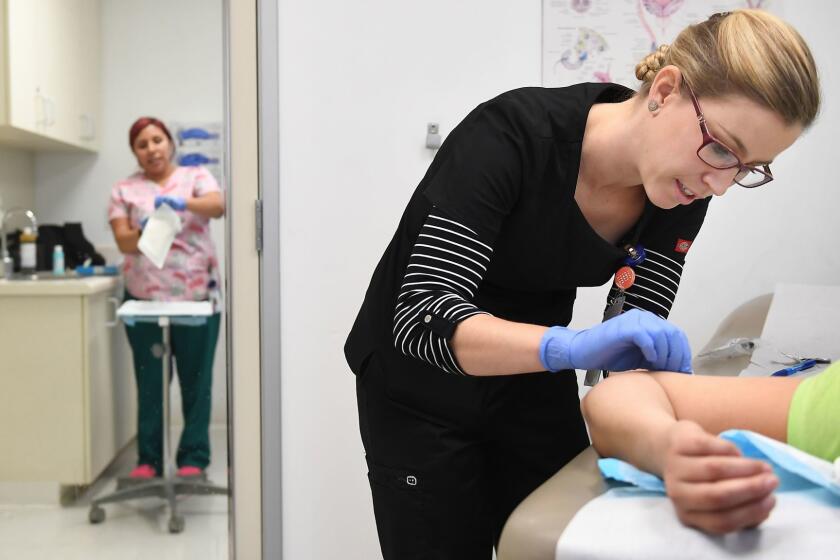 LOS ANGELES-CA-JANUARY 10, 2017: A patient gets an implant, a form of birth control, by a family nurse practitioner at Planned Parenthood in Los Angeles. (Christina House / For The Times)