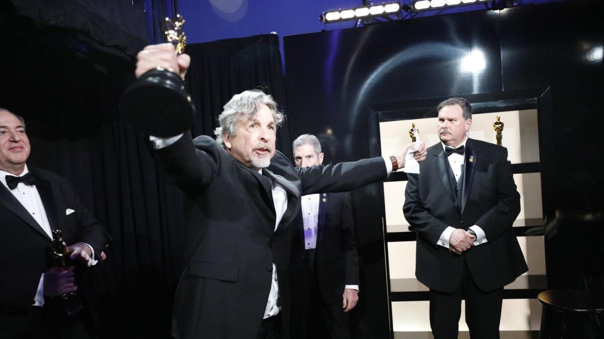 Peter Ferrelly celebrates one of "Green Book's" wins backstage at the 91st Academy Awards on Sunday at the Dolby Theatre in Hollywood.