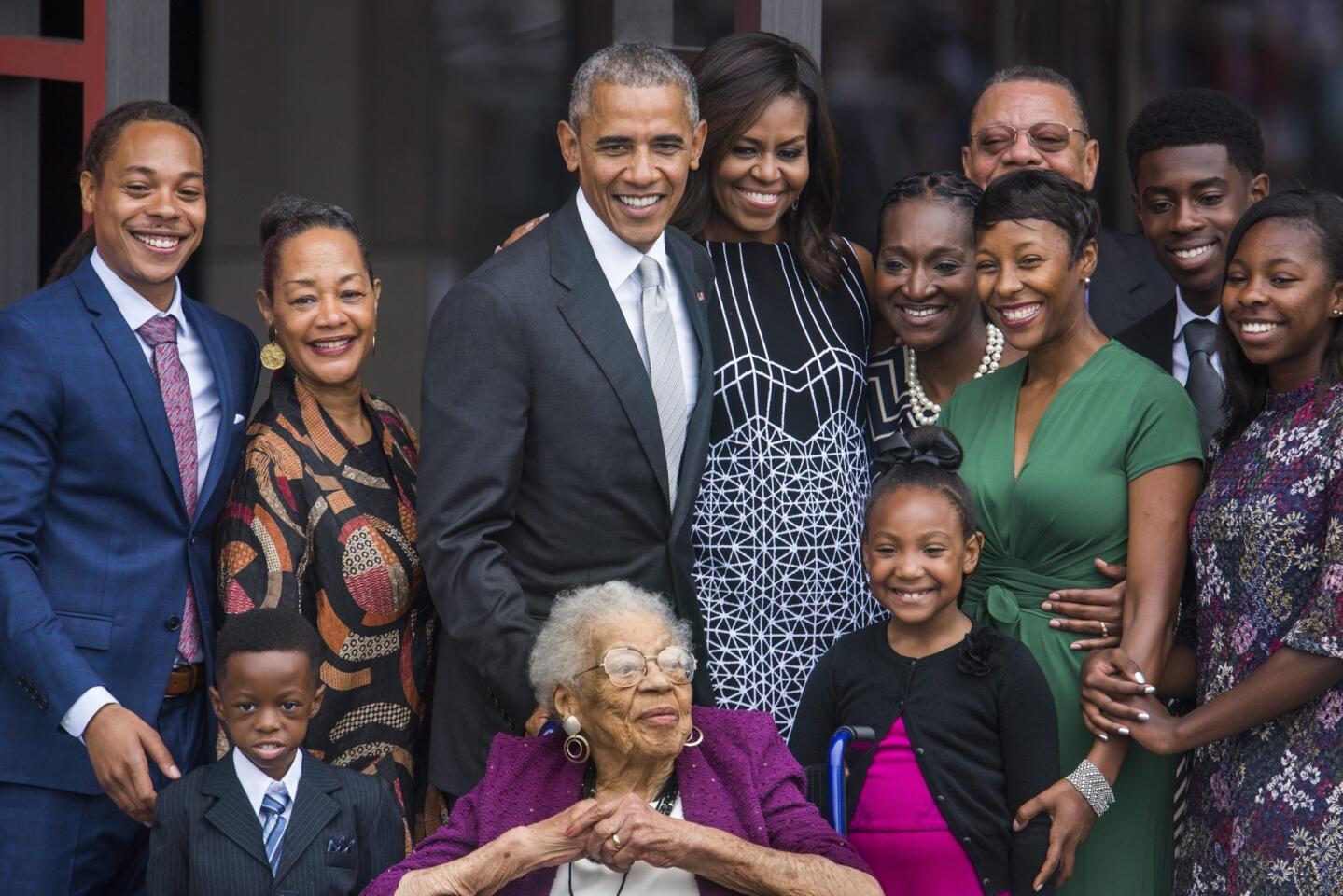 President Obama and First Lady Michelle Obama pose with four generations of the Bonner family, who are descendants of slaves, after ringing the First Baptist Church Bell to officially open the Smithsonian's National Museum of African American History and Culture in Washington, D.C.