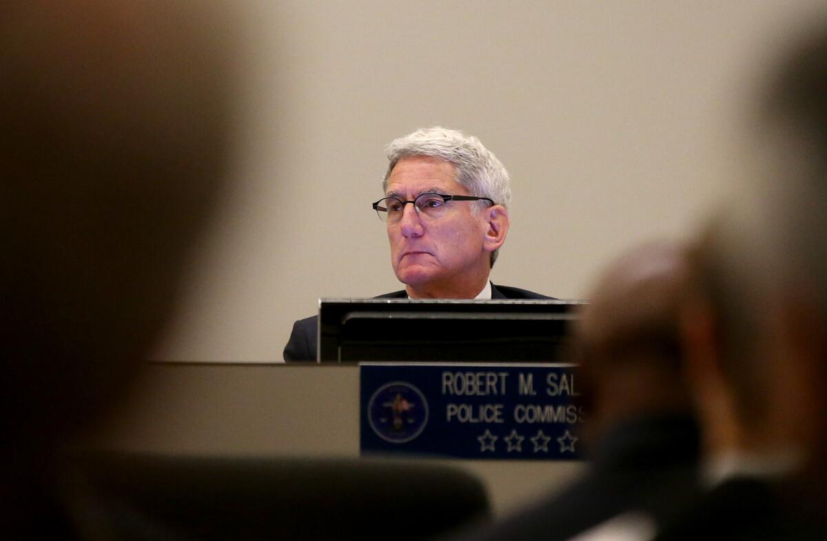 Los Angeles Police Commissioner Robert Saltzman listens to comments from the public on his last day serving on the panel on Tuesday. Saltzman served nine years on the police oversight board.