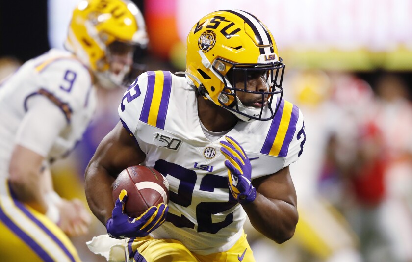 LSU running back Clyde Edwards-Helaire carries the ball.