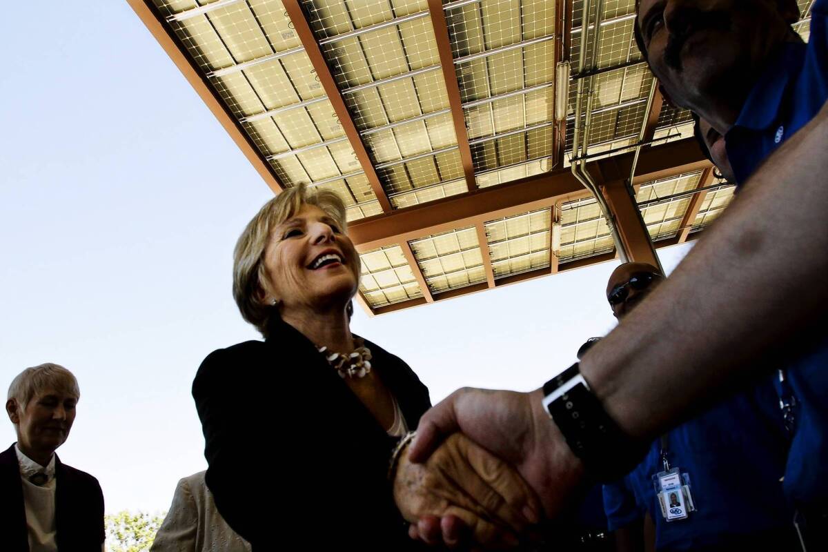 Sen. Barbara Boxer, shown dedicating a solar canopy in 2011, finds herself at odds wtih environmentalists over a move to impose deadlines on the review of water projects.