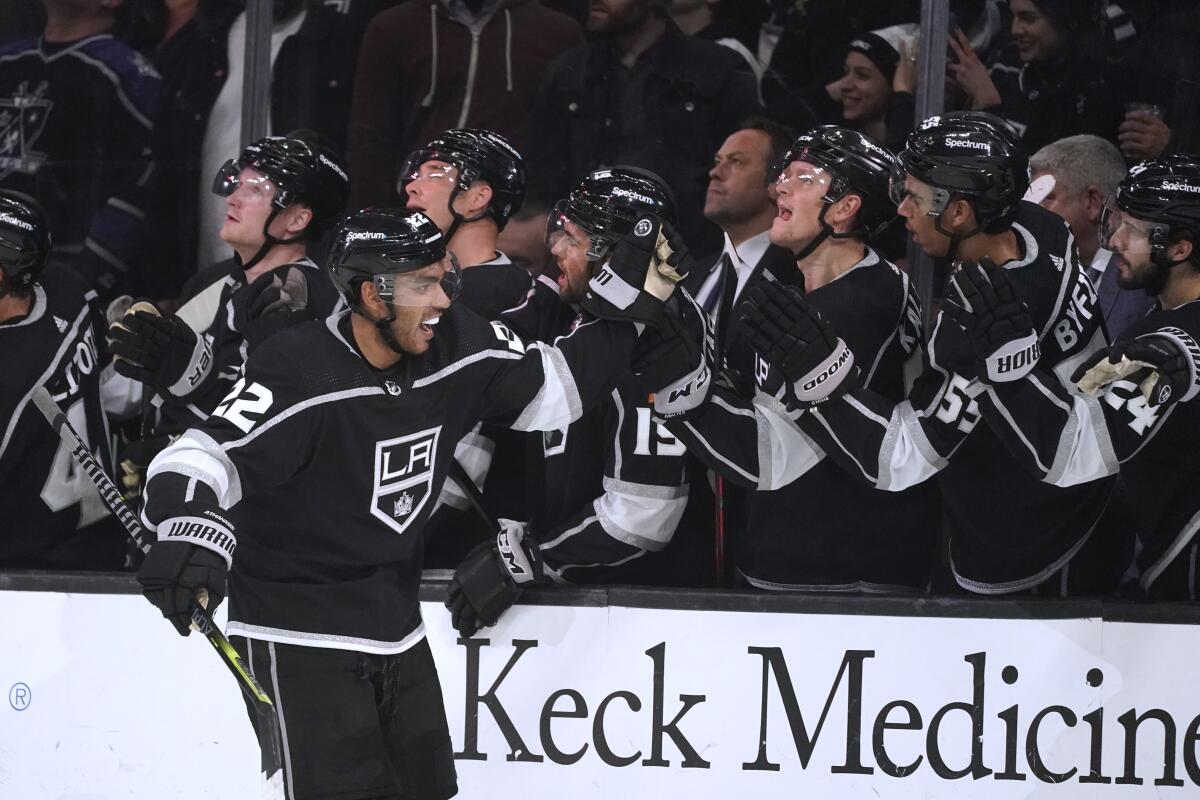 Kings center Andreas Athanasiou, is congratulated after scoring during the third period against the Chicago Blackhawks.