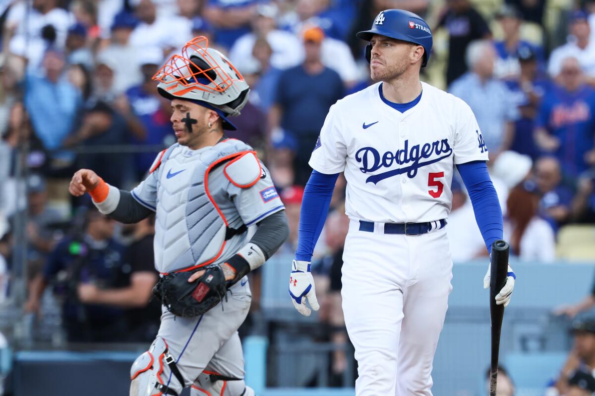 Freddie Freeman heads back to the dugout after striking out in Game 2 of the NLCS against the Mets on Oct. 14.