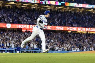 Dodgers designated player Shohei Ohtani reacts as he runs the bases after hitting a 433-foot, 2-run homer 