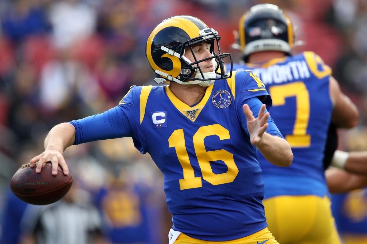 Rams quarterback Jared Goff passes the ball during a game against the Arizona Cardinals at the Coliseum.