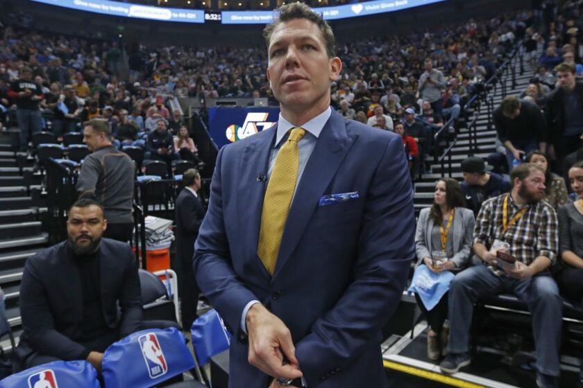 Los Angeles Lakers head coach Luke Walton walks on to the court during an NBA basketball game against the Utah Jazz Wednesday, March 27, 2019, in Salt Lake City. (AP Photo/Rick Bowmer)