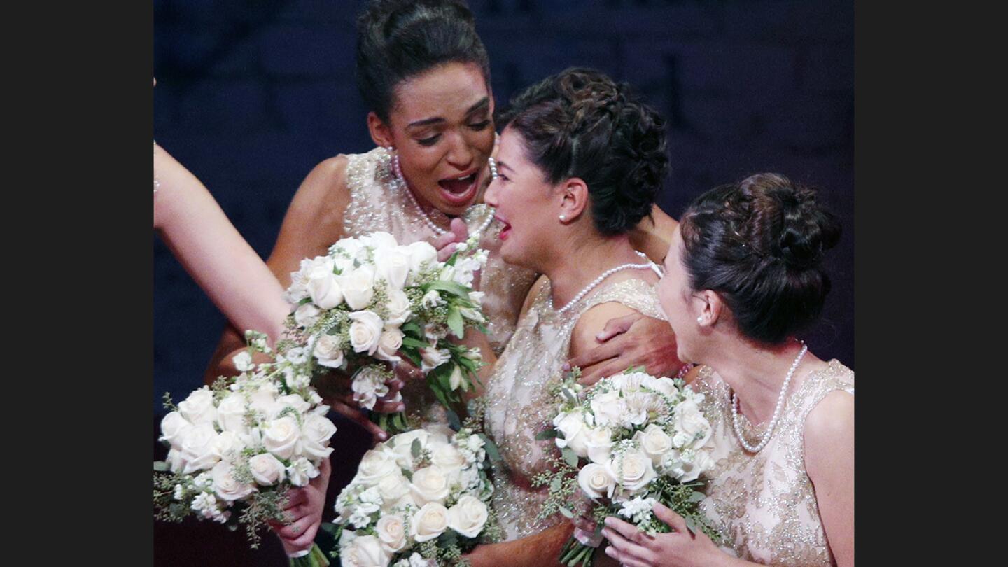 Rose princess Lauren Buehner, of Arcadia High School, embraces Isabella Marez after she is announced the 2018 Rose Queen at the 100th Rose Queen coronation at the Pasadena Playhouse on Wednesday, October 18, 2017. The Rose Queen is Isabella Maria Marez from La Salle High School.