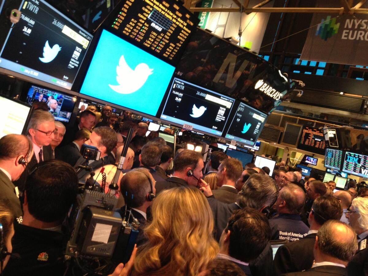Traders on the floor of the New York Stock Exchange await Twitter's first trade.