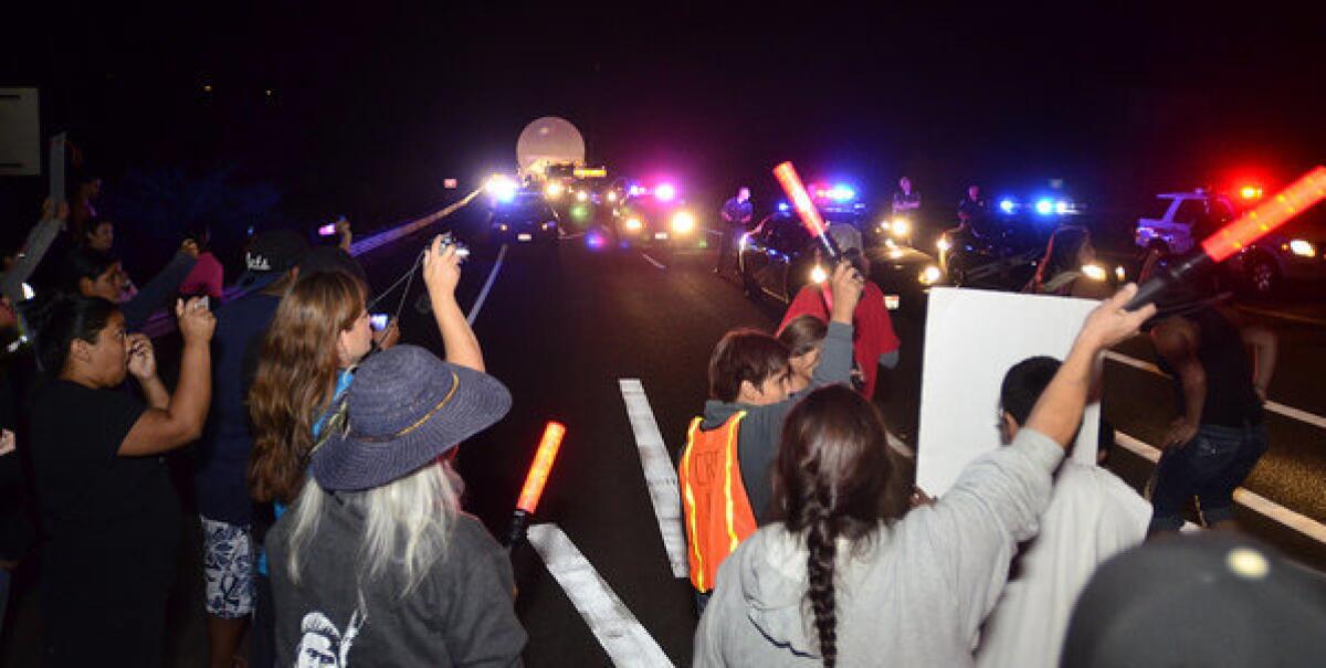 Members of the Nez Perce tribe and other protestors attempt to halt a megaload shipment carrying equipment to the Canada tar sands on Tuesday.