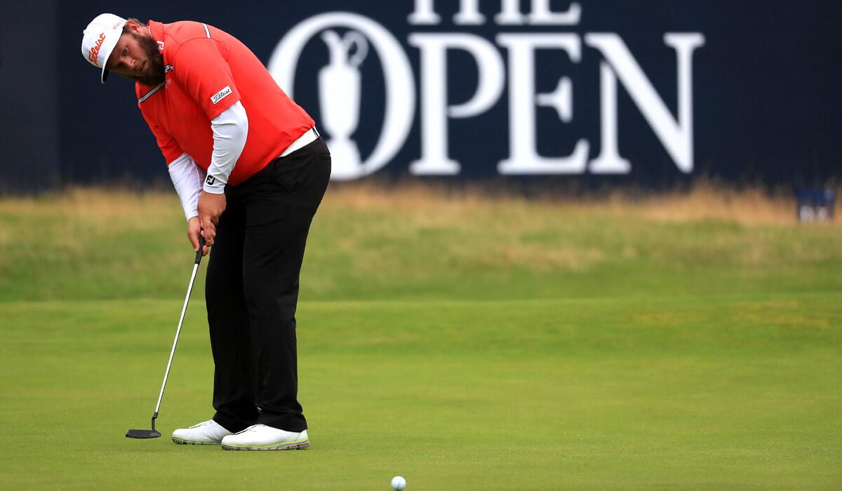 Andrew "Beef" Johnston putts on the 18th green Saturday during the third round of the British Open. At seven strokes back, he was not in the running to win on Sunday but he was thoroughly enjoying the tournament experience.