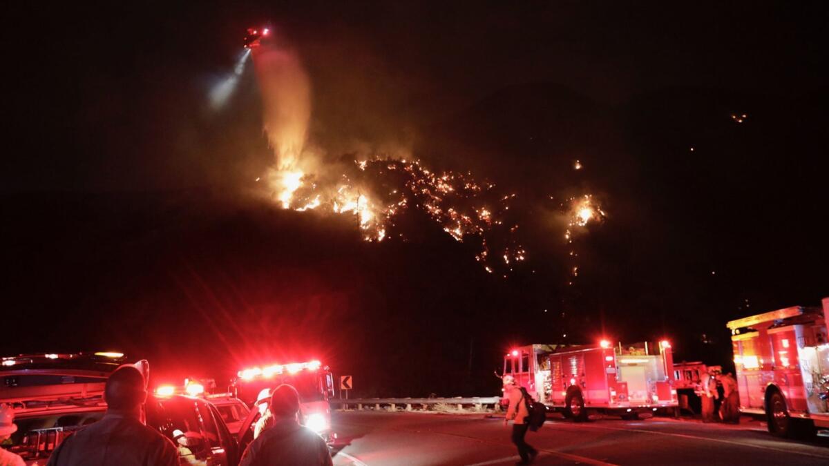 A brush fire above Claremont and Upland has grown to about 20 acres Friday evening.