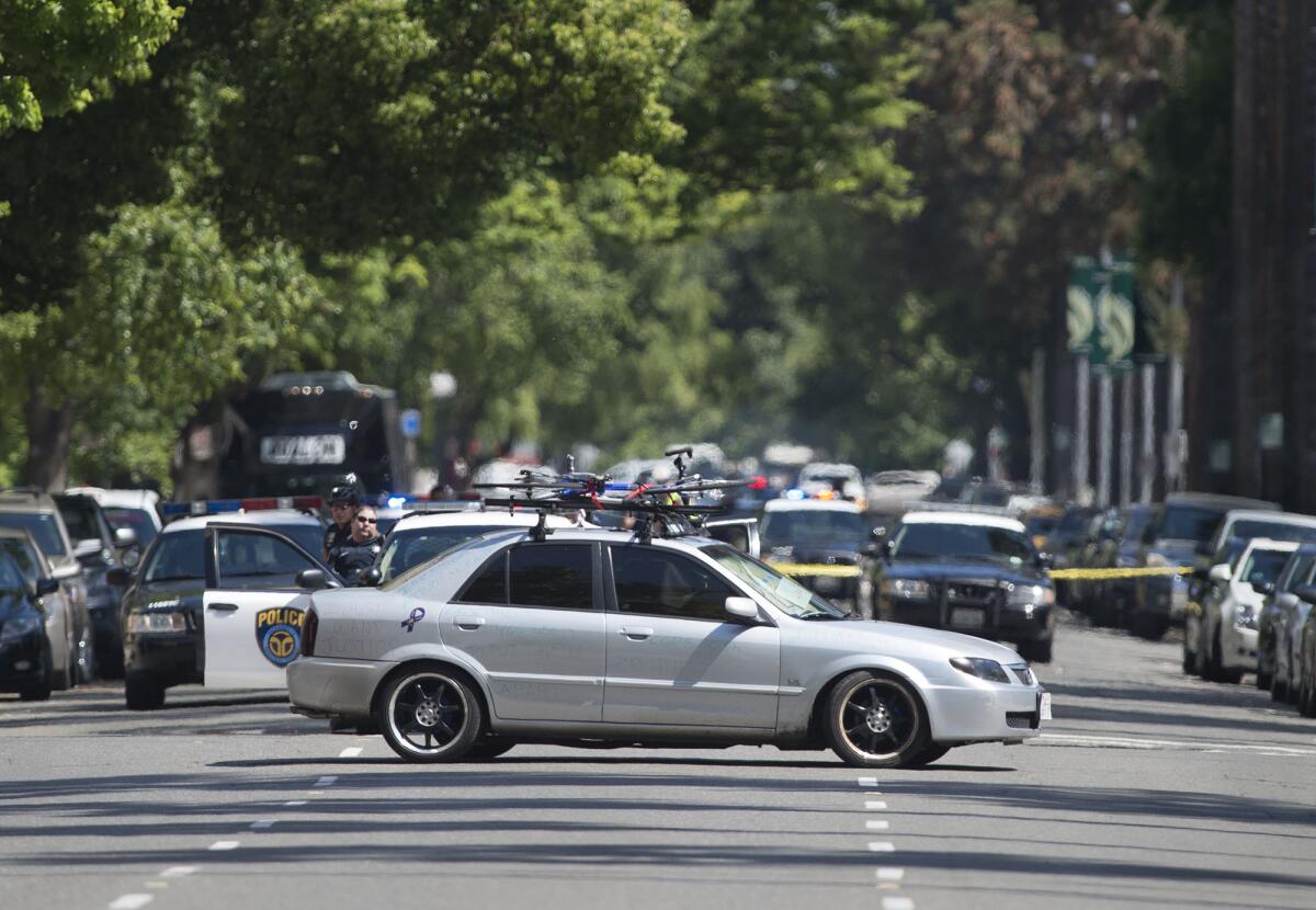 A man barricaded himself in his car while blocking an intersection on the north side of the state Capitol on Monday. He surrendered peacefully just over two hours later.