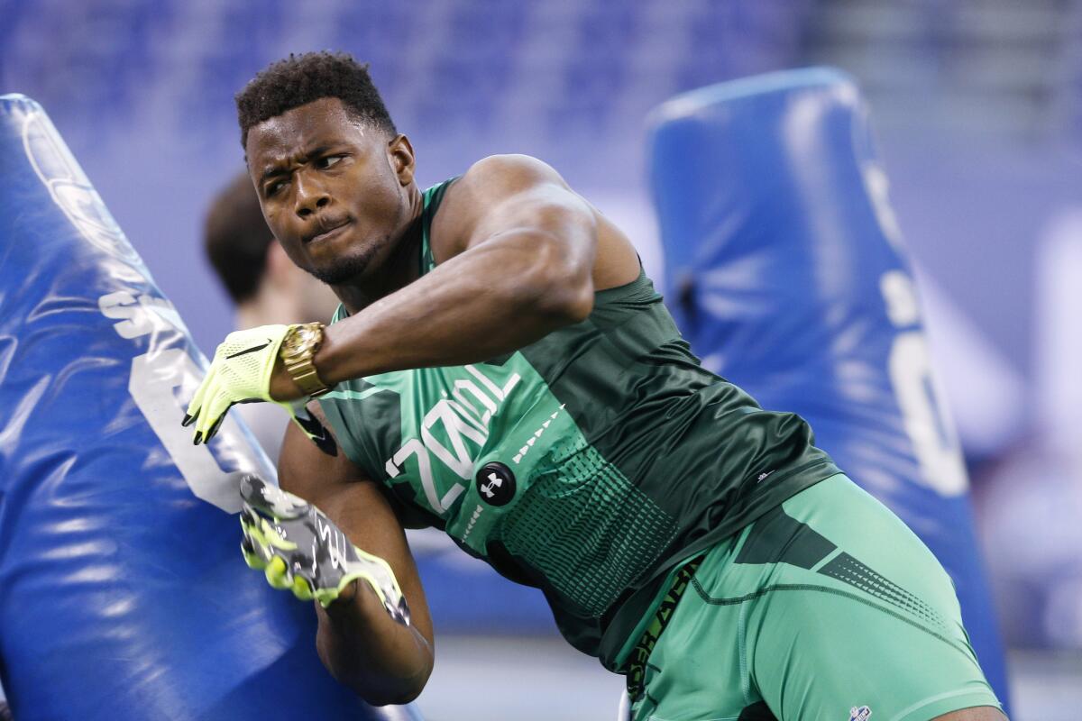 Florida defensive lineman Dante Fowler Jr. takes part in a drill at the NFL scouting combine on Feb. 22.