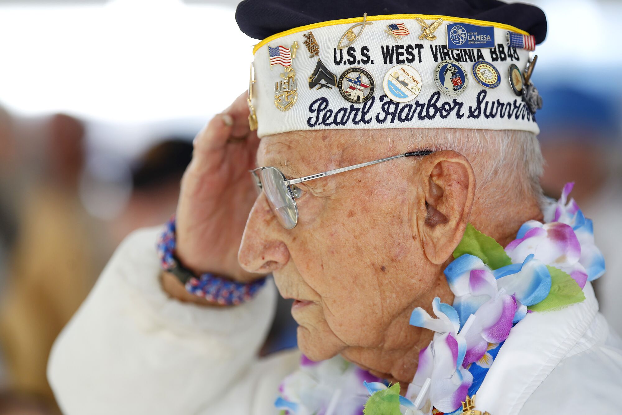 Stu Hedley, then 94, salutes during the National Anthem during Balboa Park's Veterans Museum Spirit of '45 Day in 2016.