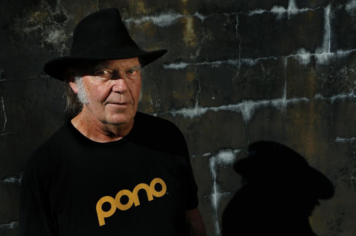 Singer-songwriter and Rock and Roll Hall of Fame member Neil Young is set to release his latest album, "Earth," on Friday.