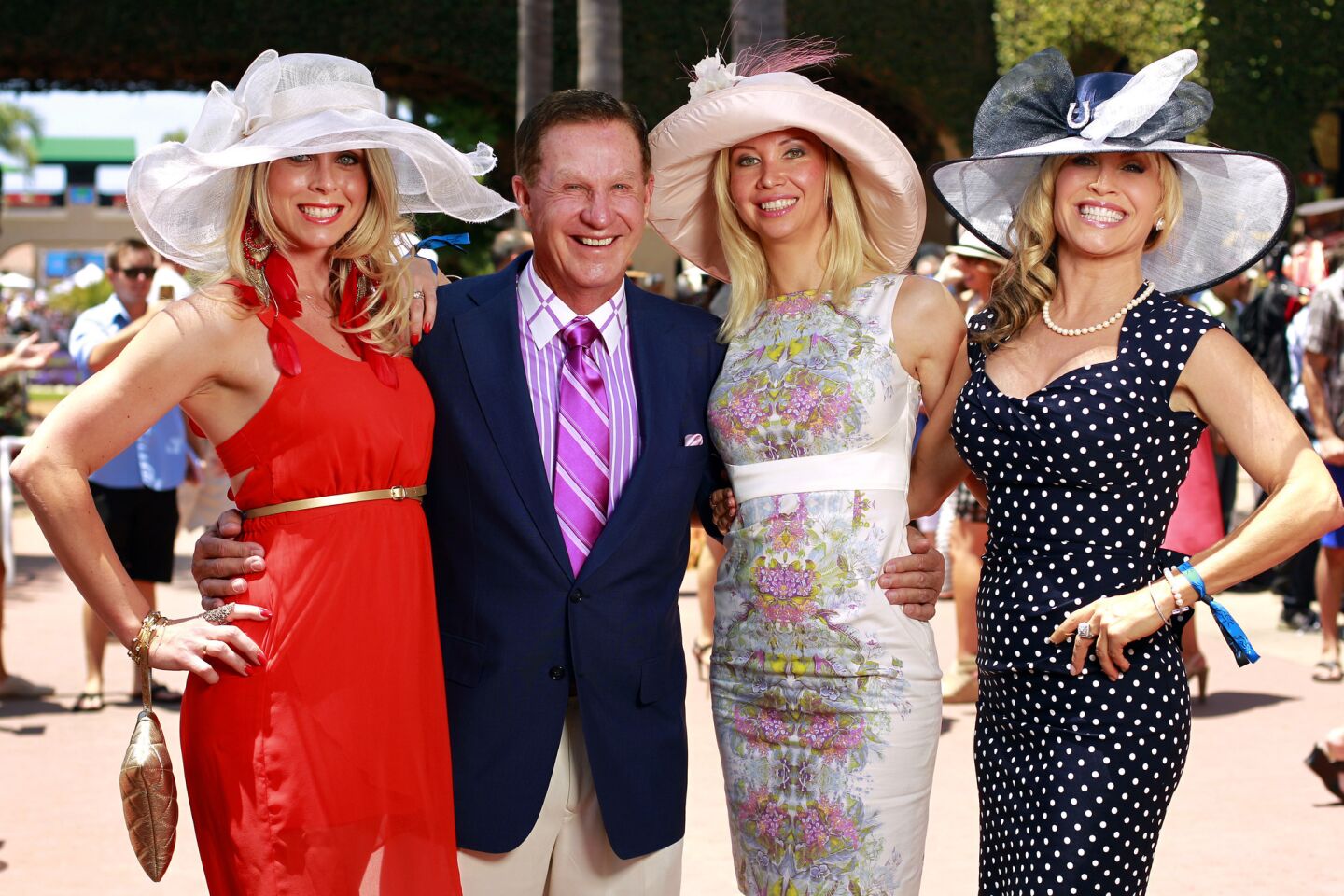 Then-owner Doug Manchester of the Union-Tribune at the Del Mar Thoroughbred Club with PR professional Stephanie Brown, wife-to-be Geniya Derzhaving and U-T TV anchor Taylor Baldwin in 2013.