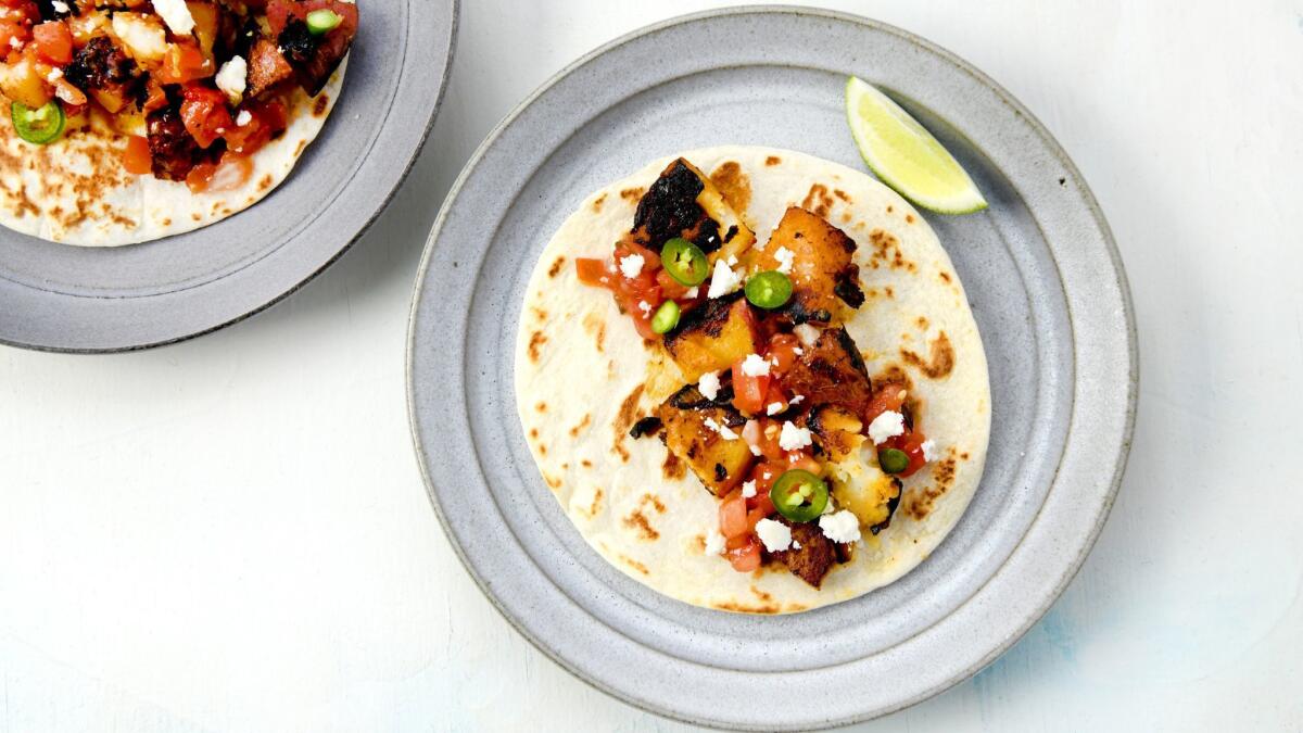 Potatoes crisped like home fries taste especially satisfying when stuffed into soft tacos.