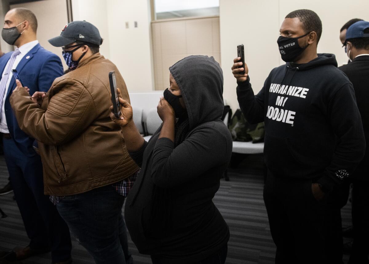 eople react after viewing the body camera footage of the killing of 20-year-old Daunte Wright
