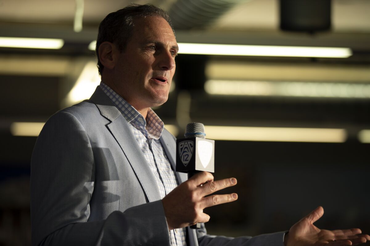 Pac-12 Commissioner Larry Scott speaks during a news conference in October 2019.