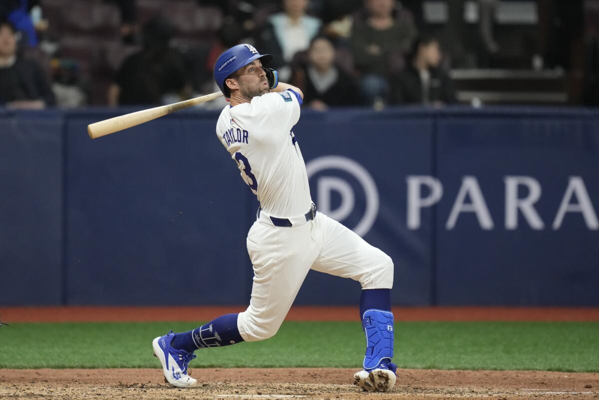 Chris Taylor hits during an exhibition game against Team Korea in March.