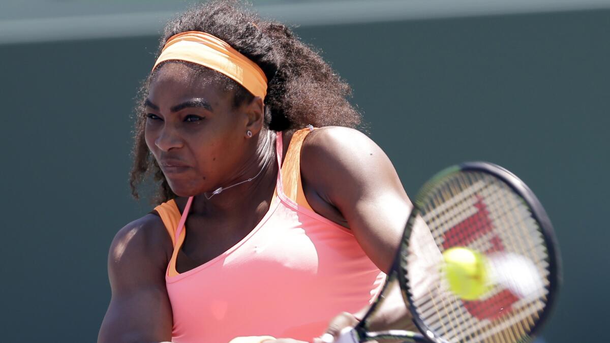 Serena Williams returns during her victory over Carla Suarez Navarro in the championship match of the Miami Open on Saturday.