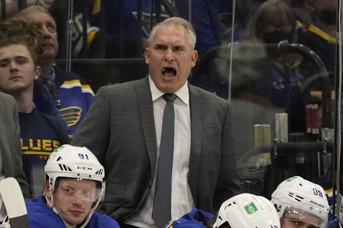 St. Louis Blues head coach Craig Berube speaks during the third period of an NHL hockey game against the Tampa Bay Lightning Thursday, Dec. 2, 2021, in Tampa, Fla. The Blues have signed coach Craig Berube to a three-year extension, Wednesday, Feb. 9, 2022. Berube became coach during the 2018-19 season and led the Blues to their only Stanley Cup championship that season. Overall he is 133-72-30. (AP Photo/Chris O'Meara)