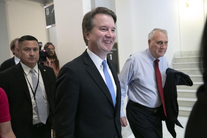 President Donald Trump's Supreme Court nominee, Judge Brett Kavanaugh, departs after meeting with Sen. Chris Coons, D-Del., a member of the Senate Judiciary Committee which will oversee his confirmation, on Capitol Hill in Washington, Thursday, Aug. 23, 2018. (AP Photo/J. Scott Applewhite)