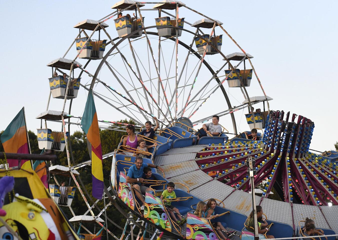Carnival-goers enjoy the rides at the Winfield fire company carnival Wednesday, July 10, 2019.