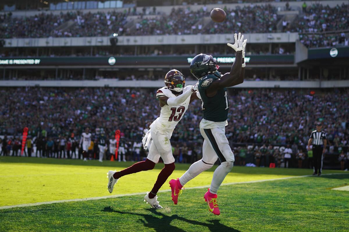 Hurts throws for 319 yards, Elliott's 54-yarder lifts 4-0 Eagles past  Commanders 34-31 in OT - The San Diego Union-Tribune