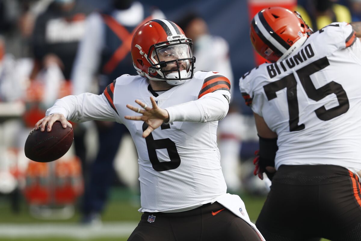 Cleveland Browns quarterback Baker Mayfield (6) passes against the Tennessee Titans in the first half of an NFL football game Sunday, Dec. 6, 2020, in Nashville, Tenn. (AP Photo/Wade Payne)
