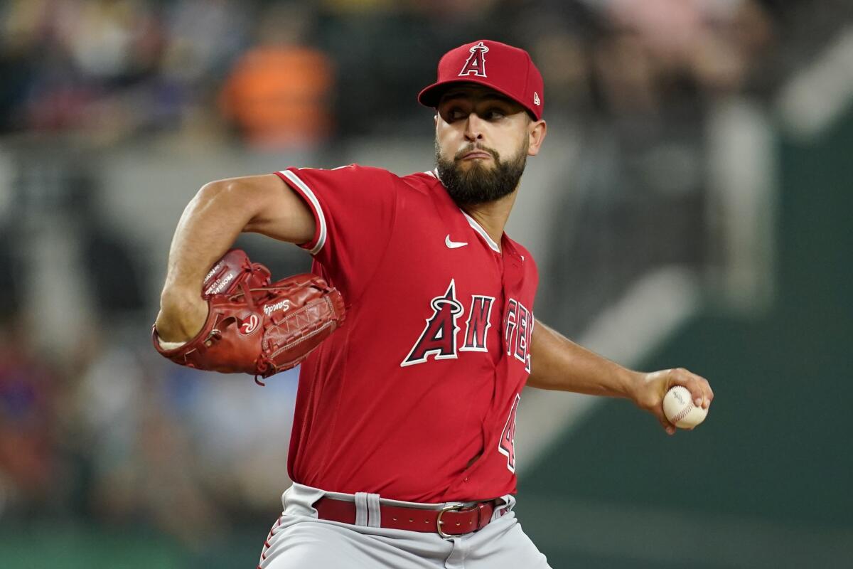 Angels pitcher Patrick Sandoval throws to a Texas Rangers batter.