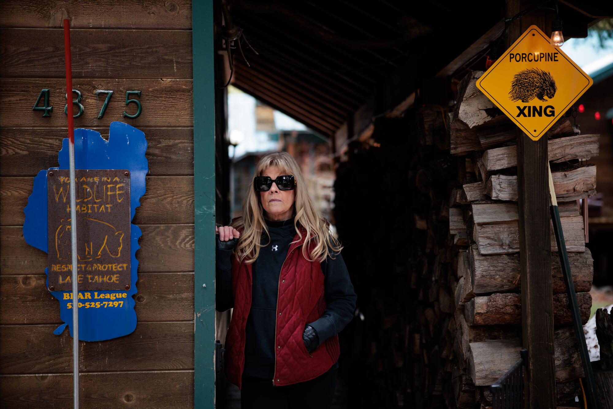 Ann Bryant, executive director of the Tahoe Basin Bear League, stands in a doorway.