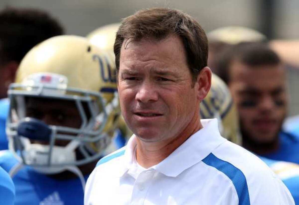 UCLA's football team has begun practicing at 7 a.m. "They get up and we have their full attention," Coach Jim Mora says of the new schedule.