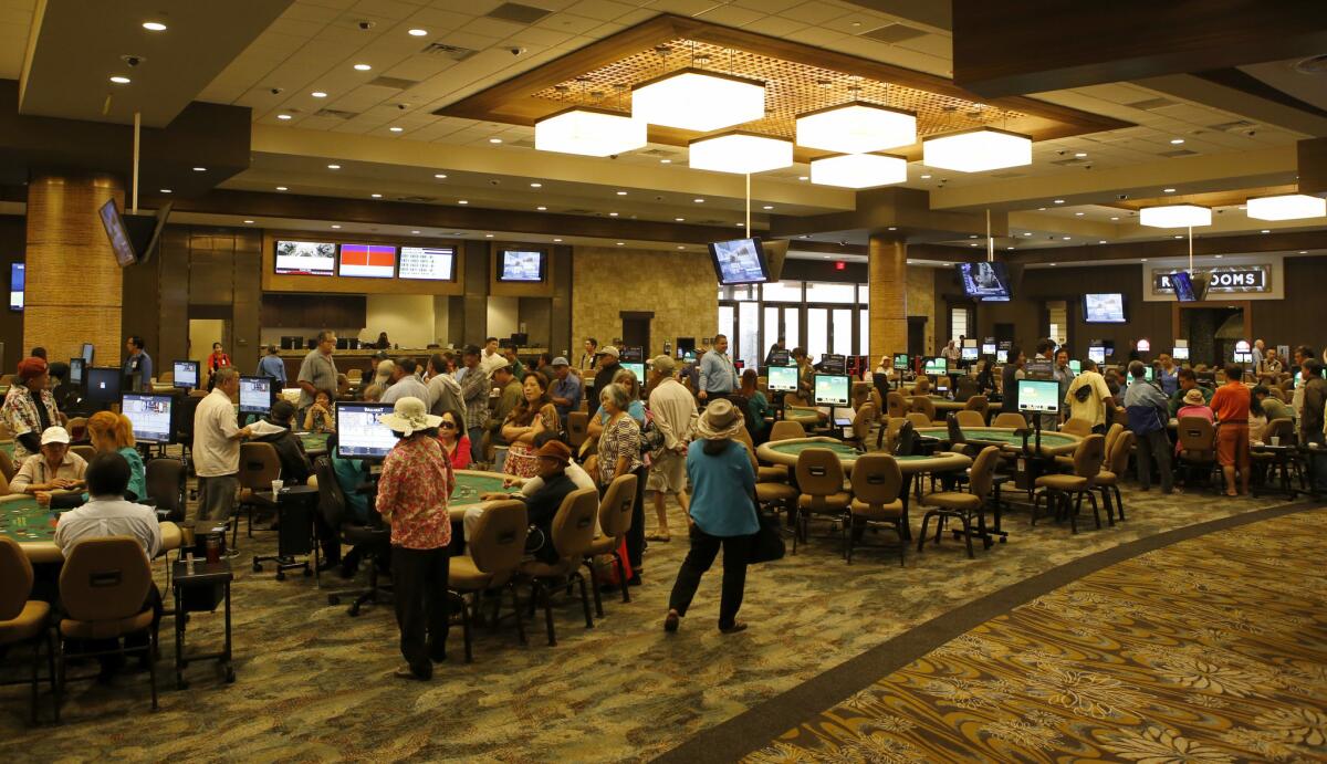 Card players try their luck at various games at the Gardens Casino in Hawaiian Gardens. The facility has undergone a $90-million overhaul and expansion.