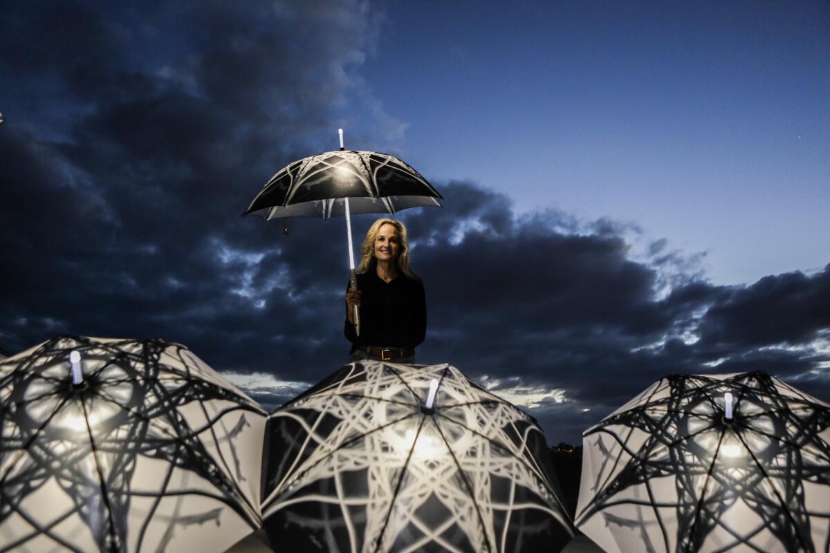 Light-up umbrellas will culminate in a night performance on a Southern California beach by artist Elizabeth Turk.