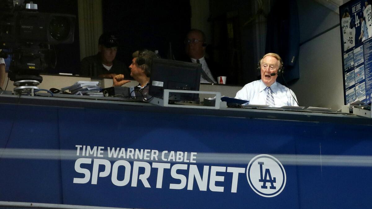 Vin Scully calls a Dodgers game. The programming and job cuts at Time Warner Cable Sports will not affect broadcasts of Dodgers or Lakers games.