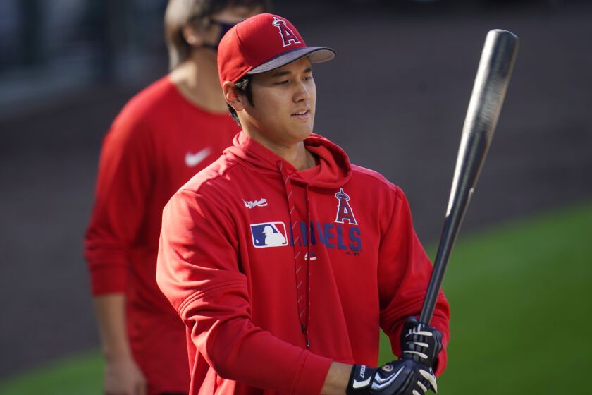 Los Angeles Angels designated hitter Shohei Ohtani warms up before a baseball game.